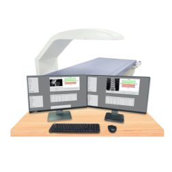 A bone densitometer machine with two computers attached to it.