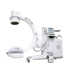A white C-arm machine with an image intensifier and an X-ray tube.