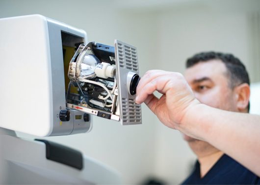 Medical imaging equipment repair being done by an experienced technician.
